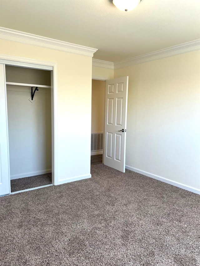 1565 Bluejay, Hanford, CA 93230 - unfurnished bedroom featuring crown molding, carpet floors, a closet, and baseboards
