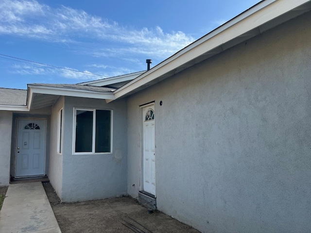 1565 Bluejay, Hanford, CA 93230 - entrance to property featuring stucco siding