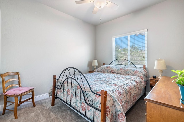 carpeted bedroom featuring baseboards and a ceiling fan