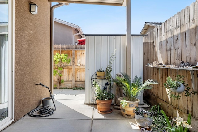 view of patio featuring fence