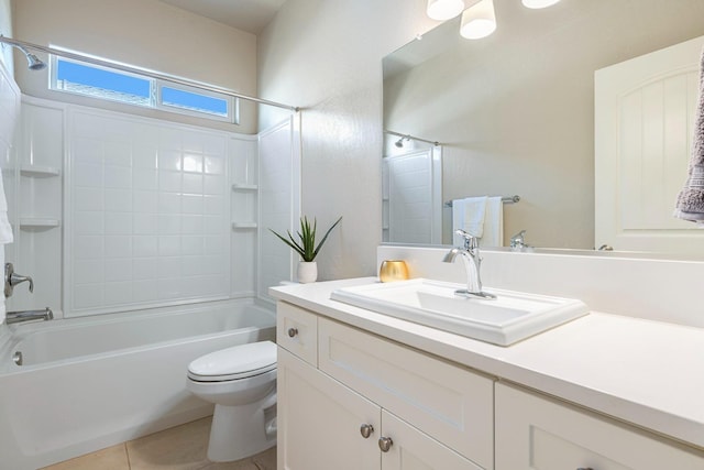 bathroom featuring toilet, tile patterned flooring, shower / washtub combination, and vanity