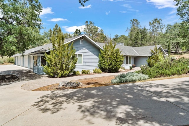 43443 Running Deer Dr, Coarsegold, CA 93614 - view of side of property with driveway and an attached garage