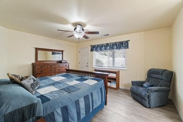 43443 Running Deer Dr, Coarsegold, CA 93614 - bedroom with baseboards, a ceiling fan, and light wood-style flooring