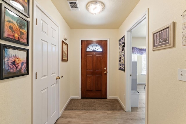 43443 Running Deer Dr, Coarsegold, CA 93614 - entrance foyer with visible vents, baseboards, and light wood-type flooring