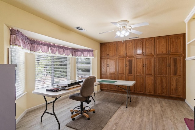 43443 Running Deer Dr, Coarsegold, CA 93614 - office area with visible vents, ceiling fan, light wood finished floors, and baseboards
