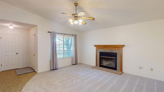 1201 Rayser St, Kingsburg, CA 93631 - unfurnished living room with a tile fireplace, carpet floors, a ceiling fan, a textured ceiling, and lofted ceiling