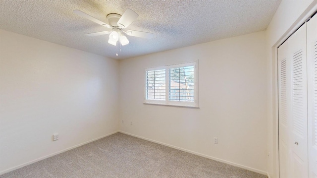 1201 Rayser St, Kingsburg, CA 93631 - unfurnished bedroom featuring baseboards, light carpet, a textured ceiling, and a closet