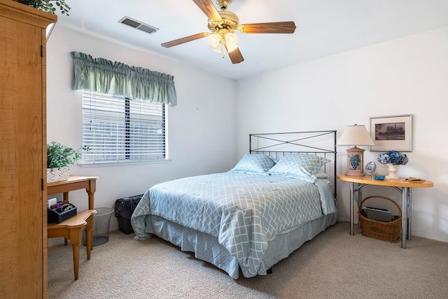 bedroom featuring visible vents, carpet, and ceiling fan