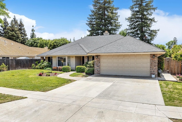 ranch-style home featuring fence, a front yard, brick siding, an attached garage, and driveway