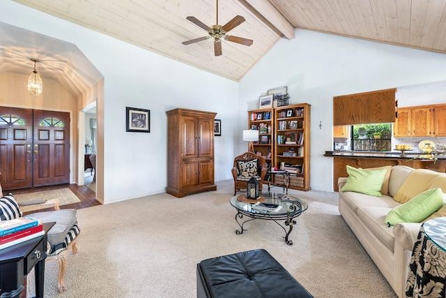 living room with ceiling fan, light colored carpet, high vaulted ceiling, wooden ceiling, and beamed ceiling