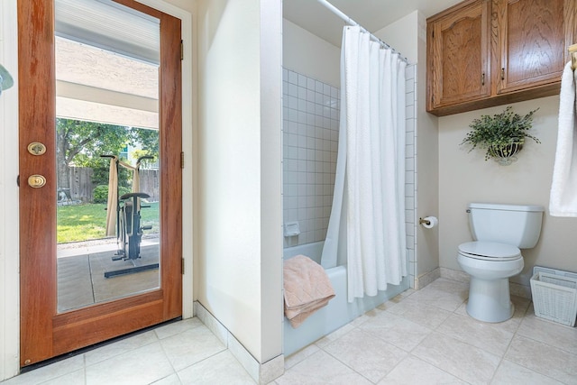 full bathroom featuring toilet, visible vents, shower / bath combo, and tile patterned flooring