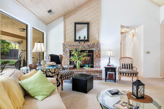 carpeted living room with visible vents, wood ceiling, and a fireplace