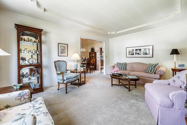 living area featuring light colored carpet