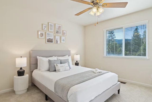 bedroom featuring a ceiling fan, carpet floors, and baseboards