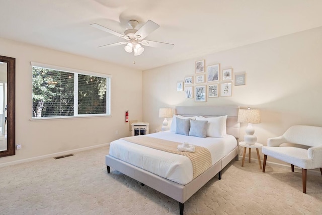 bedroom with visible vents, ceiling fan, baseboards, and carpet floors