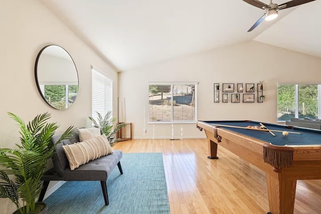 recreation room with light wood finished floors, ceiling fan, a wealth of natural light, and lofted ceiling