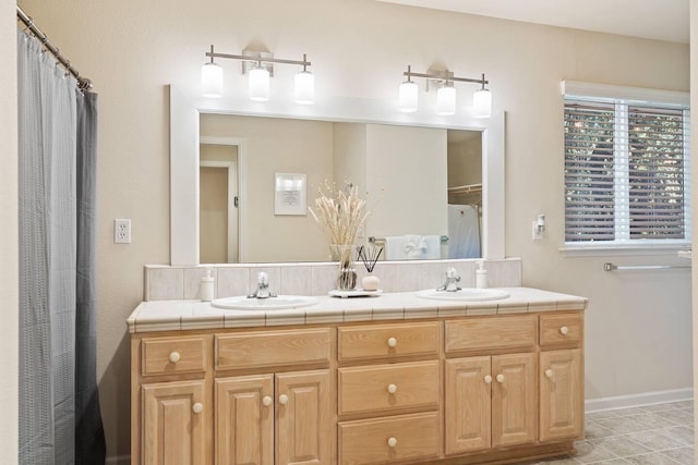 bathroom with double vanity and a sink