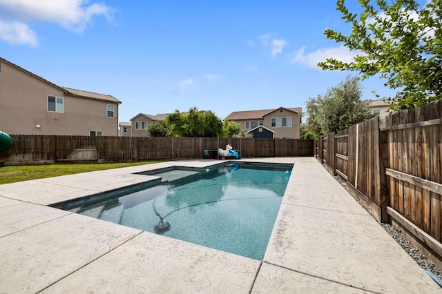 view of swimming pool with a fenced backyard, a residential view, and a fenced in pool