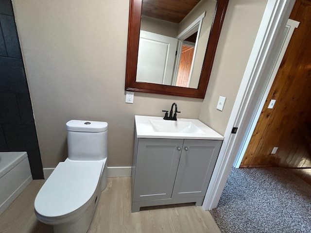 31083 Bear Paw Way, Coarsegold, CA 93614 - bathroom featuring wood finished floors, vanity, toilet, and baseboards