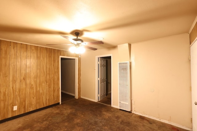 1850 Sheridan St Unit 3/4, Selma, CA 93662 - unfurnished bedroom featuring a heating unit, wooden walls, baseboards, a closet, and ceiling fan