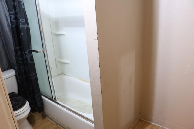 1850 Sheridan St Unit 3/4, Selma, CA 93662 - full bathroom featuring toilet, wood finished floors, and shower / bath combination with glass door