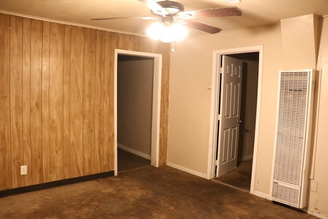 1850 Sheridan St Unit 3/4, Selma, CA 93662 - unfurnished bedroom with a heating unit, wood walls, carpet, baseboards, and ceiling fan