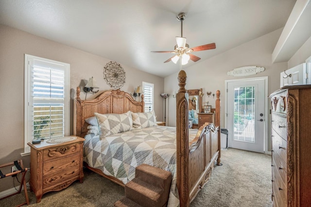 bedroom featuring vaulted ceiling, light colored carpet, access to exterior, and multiple windows