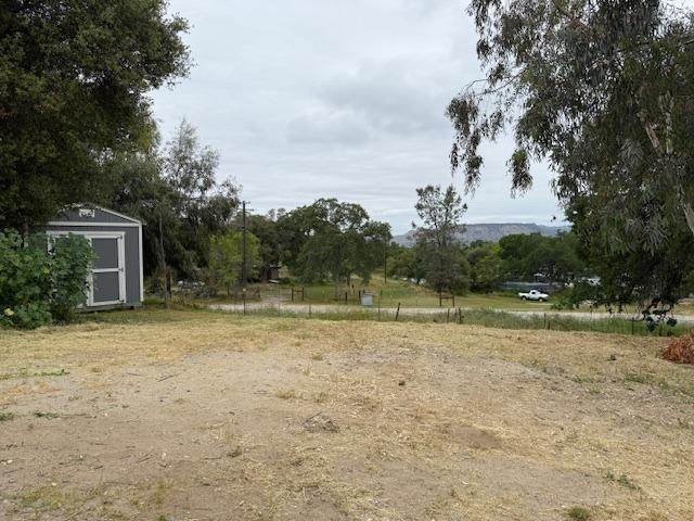 28826 Auberry Rd, Clovis, CA 93619 - view of yard featuring an outdoor structure and a shed