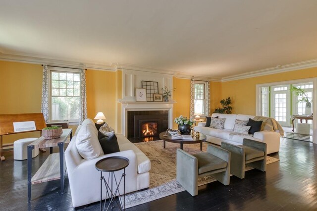 605 E Home Ave, Fresno, CA 93728 - living room with plenty of natural light, a fireplace with flush hearth, ornamental molding, and wood finished floors