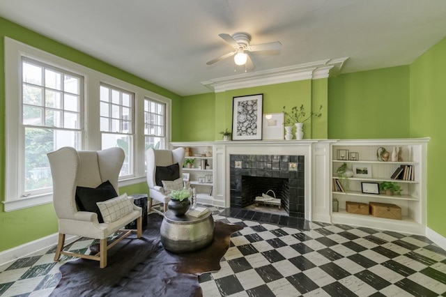 605 E Home Ave, Fresno, CA 93728 - sitting room featuring a ceiling fan, baseboards, tile patterned floors, and a tile fireplace