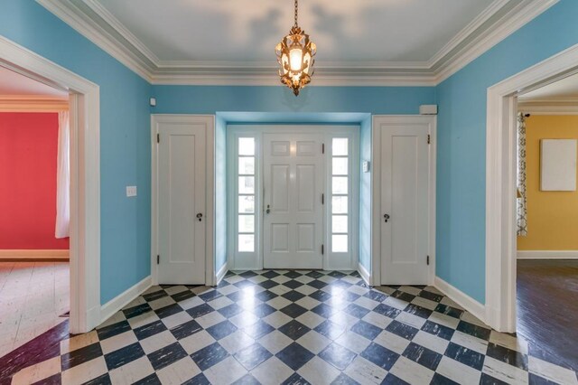 605 E Home Ave, Fresno, CA 93728 - entrance foyer with baseboards, ornamental molding, tile patterned floors, and a chandelier