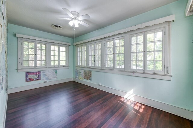 605 E Home Ave, Fresno, CA 93728 - unfurnished room with a ceiling fan, baseboards, visible vents, and dark wood-type flooring