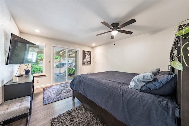 bedroom with recessed lighting, a ceiling fan, access to outside, and wood finished floors