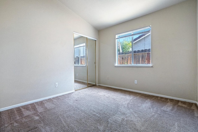 5634 W Donner Ave, Fresno, CA 93722 - carpeted spare room featuring baseboards and lofted ceiling