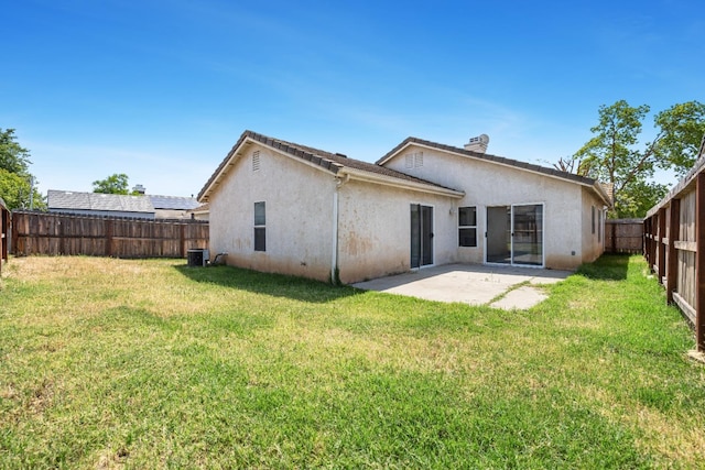 5634 W Donner Ave, Fresno, CA 93722 - back of property with stucco siding, a patio, and cooling unit