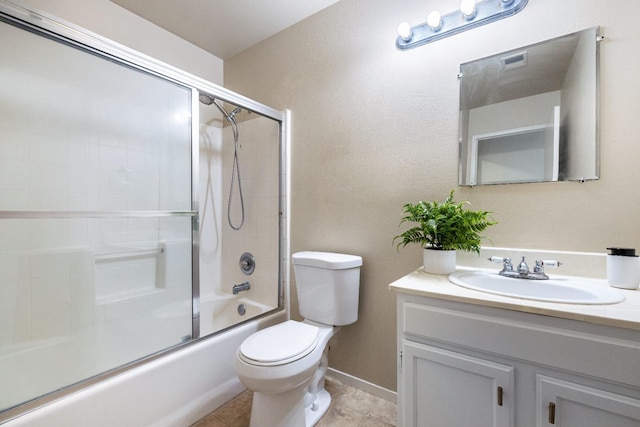 5634 W Donner Ave, Fresno, CA 93722 - full bath with toilet, vanity, shower / bath combination with glass door, and tile patterned flooring