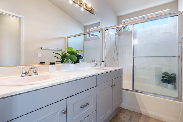 5634 W Donner Ave, Fresno, CA 93722 - bathroom with double vanity, shower / bath combination with glass door, and tile patterned flooring