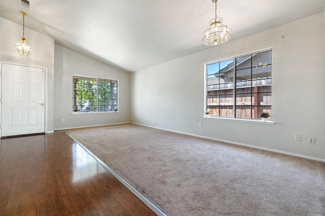5634 W Donner Ave, Fresno, CA 93722 - interior space with a notable chandelier, lofted ceiling, visible vents, baseboards, and wood finished floors