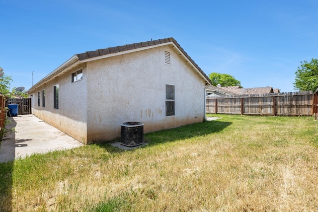 5634 W Donner Ave, Fresno, CA 93722 - back of house featuring stucco siding and central AC unit
