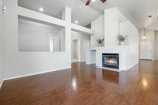 5634 W Donner Ave, Fresno, CA 93722 - unfurnished living room with wood finished floors, ceiling fan, high vaulted ceiling, and baseboards