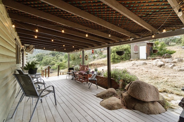 31008 N Dome Dr, Coarsegold, CA 93614 - wooden terrace featuring a storage shed and an outbuilding