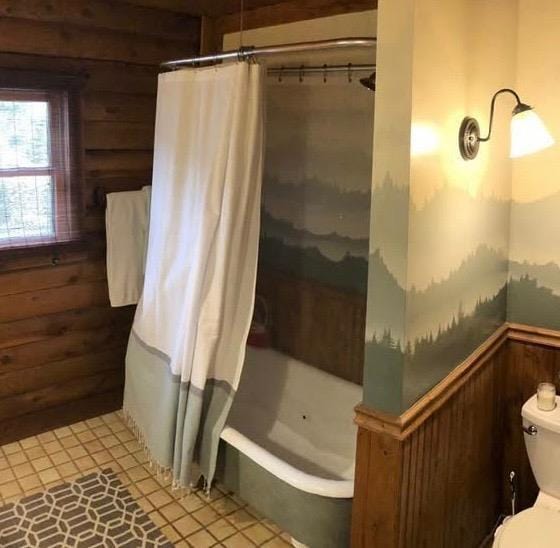 31008 N Dome Dr, Coarsegold, CA 93614 - bathroom with wooden walls, toilet, tile patterned flooring, and wainscoting