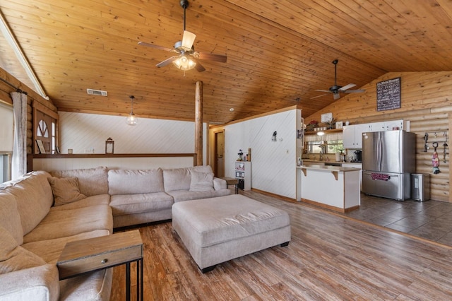 31008 N Dome Dr, Coarsegold, CA 93614 - living area with ceiling fan, wood ceiling, high vaulted ceiling, wood walls, and dark wood-type flooring