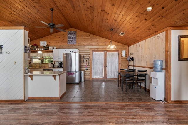 31008 N Dome Dr, Coarsegold, CA 93614 - kitchen with freestanding refrigerator, lofted ceiling, wooden ceiling, a peninsula, and dark wood-style floors
