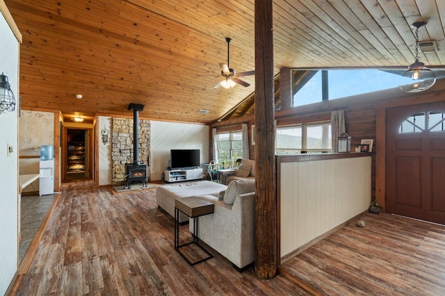 31008 N Dome Dr, Coarsegold, CA 93614 - living room with a wood stove, wood-type flooring, a ceiling fan, wooden walls, and wooden ceiling