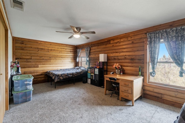 31008 N Dome Dr, Coarsegold, CA 93614 - carpeted bedroom with rustic walls, a desk, and ceiling fan