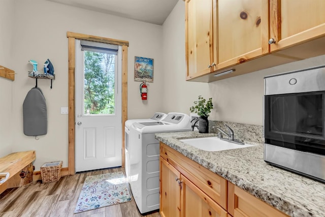 42596 Garnet Ln, Shaver Lake, CA 93664 - laundry area with separate washer and dryer, a sink, and light wood-style floors