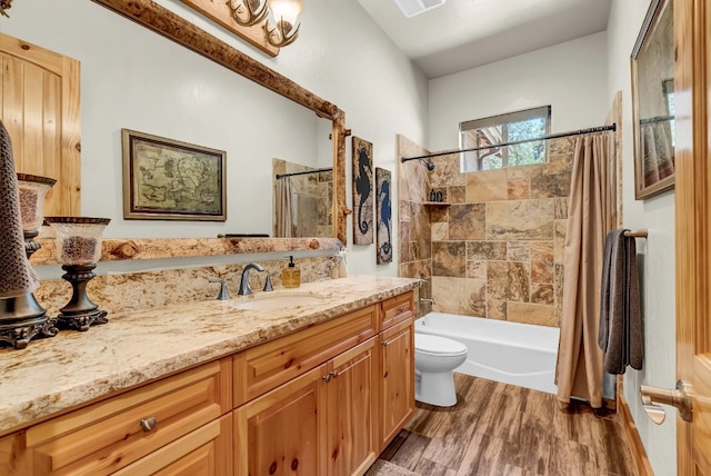 42596 Garnet Ln, Shaver Lake, CA 93664 - full bath with visible vents, shower / bath combo with shower curtain, toilet, wood finished floors, and vanity