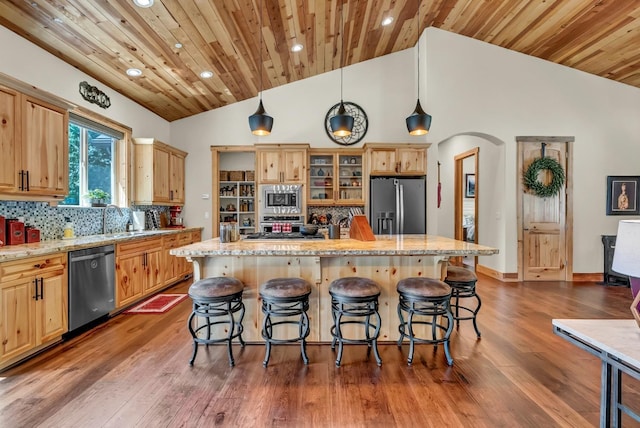 42596 Garnet Ln, Shaver Lake, CA 93664 - kitchen featuring stainless steel appliances, recessed lighting, wood ceiling, a sink, and a breakfast bar