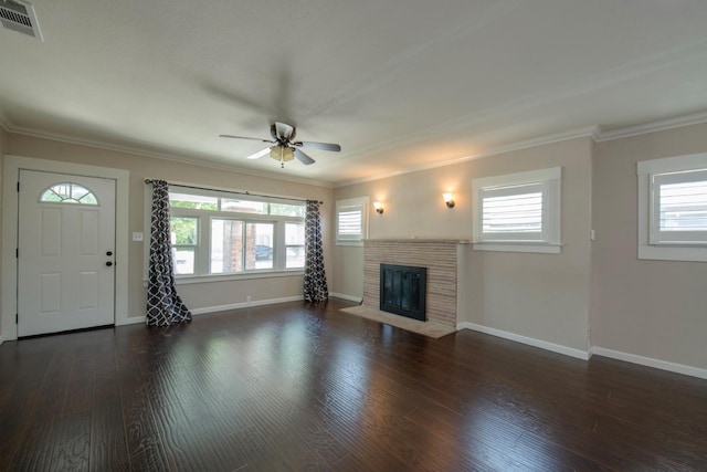unfurnished living room with ceiling fan, a fireplace with flush hearth, hardwood / wood-style flooring, and visible vents